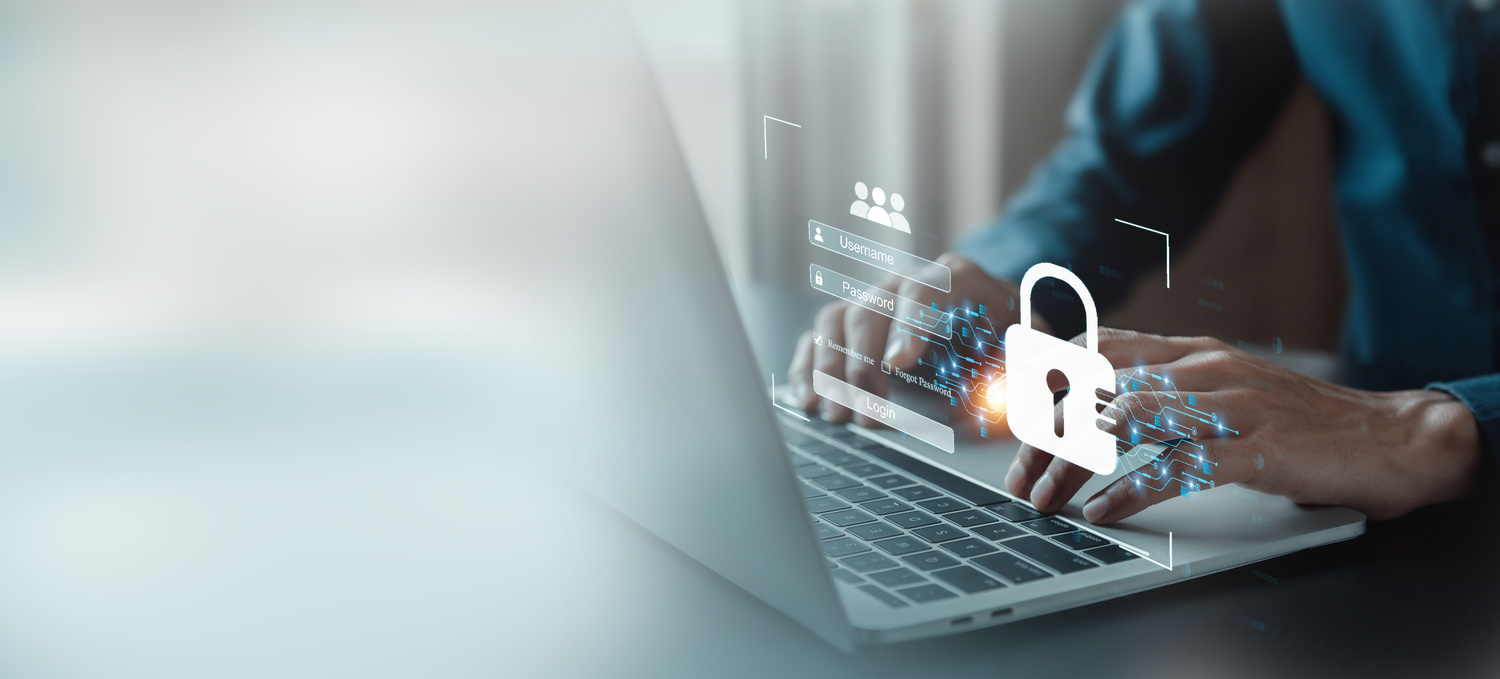 Utilisateur saisissant ses identifiants sur un ordinateur portable sécurisé.
